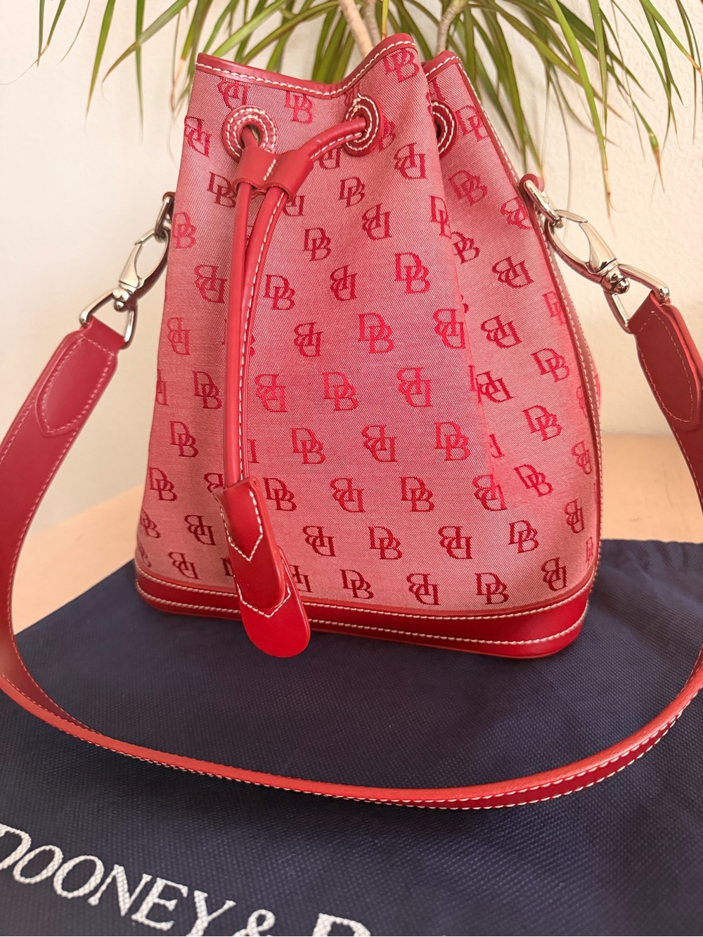 Dooney & Bourke North South Triple Zip Bucket Bag